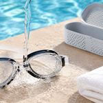 Swim goggles being rinsed gently after a pool session