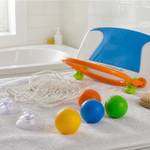 Clean bath basketball hoop, suction cups, net, and toy balls drying